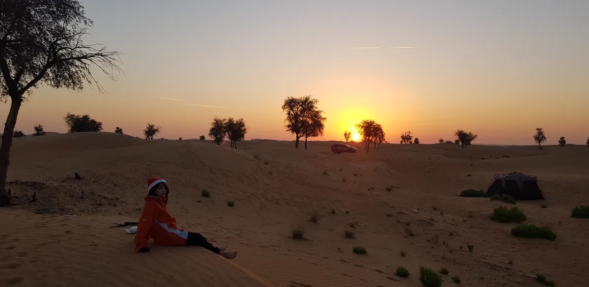 Sitting out for the sunset beside the tent, camping in the UAE desert